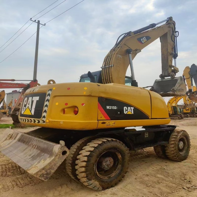 Tweedehands graafmachine Originele Cat M315D Gebruikte 15ton wielgraafmachine met bak van 0,61 m3