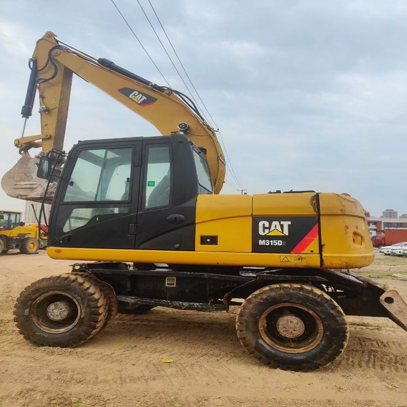 Tweedehands graafmachine Originele Cat M315D Gebruikte 15ton wielgraafmachine met bak van 0,61 m3
